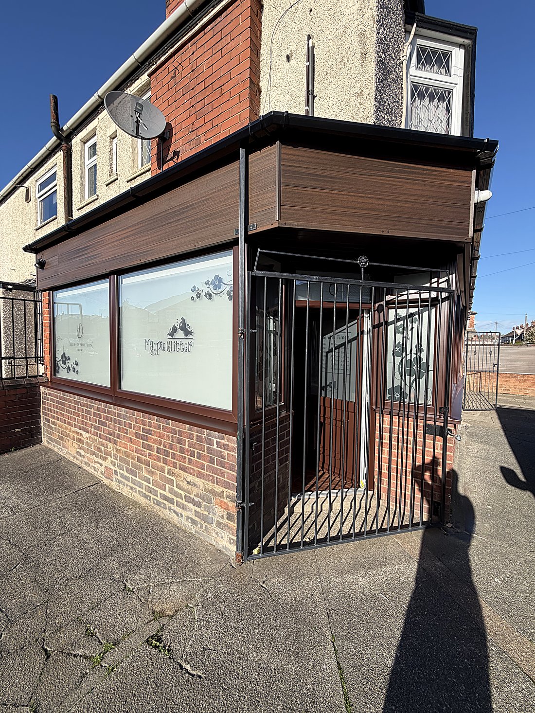 Commercial spraying after — UPVC windows and doors of a beauty and spa premises in Grimsby finished in a woodgrain-effect sprayed coating