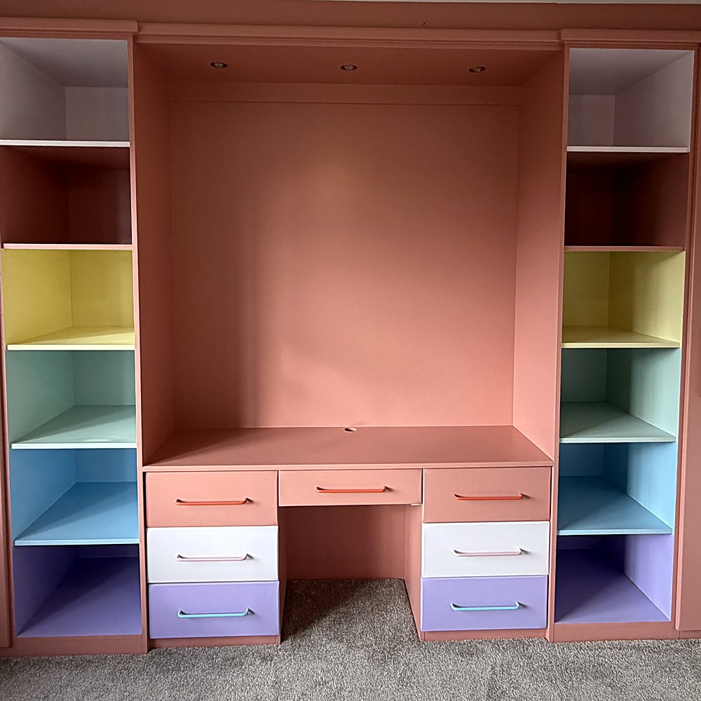 Wardrobe spraying Grimsby — after: fitted wardrobes sprayed in dusky pink with rainbow-coloured niches